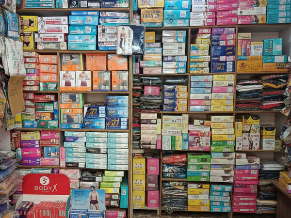 Display of various products including boxes and packaging in a store setting.