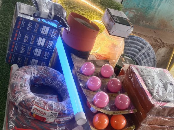Colorful items including a blue light, small balls, and a toy car on a surface with a blurred background.