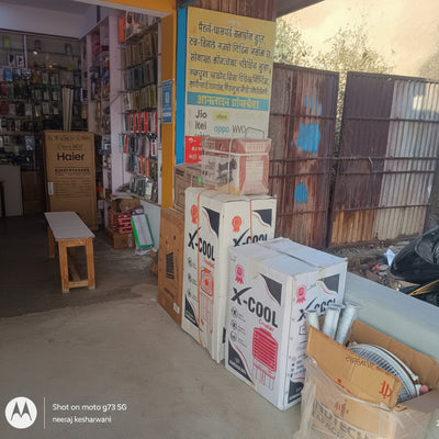 Stack of boxes with product packaging on a concrete floor