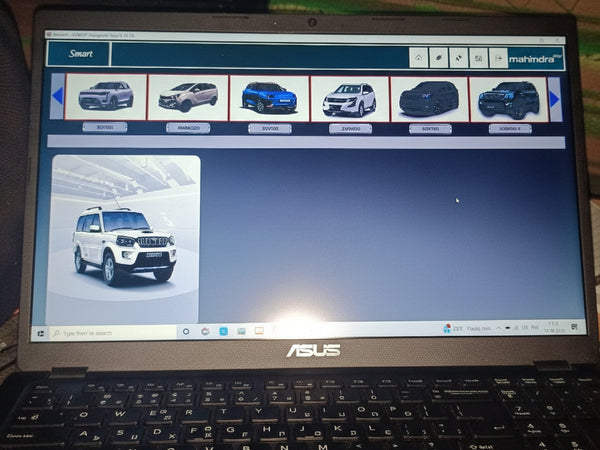Computer screen displaying a vehicle selection interface with images of cars.