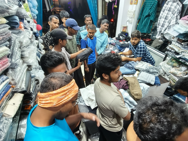 Customers shopping at श्री राधा कृष्णा मेंस वियर
