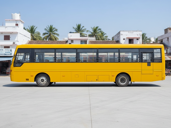 Jaiswal Tour and Travels large yellow bus side view – square optimized