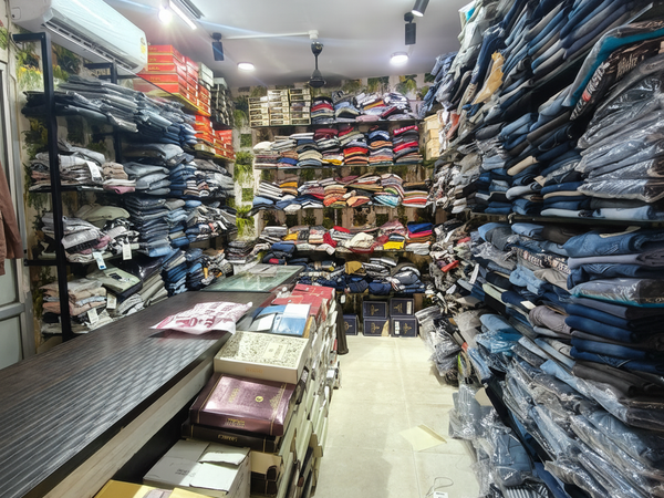 श्री राधा कृष्णा मेंस वियर shop interior with large collection of men's clothing
