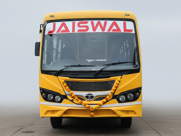 Jaiswal Tour and Travels yellow Tata bus front view with marigold garland – square optimized